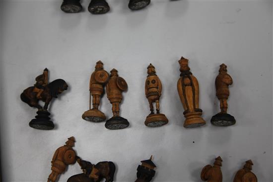 An unusual 19th century Russian figural carved wood chess set,